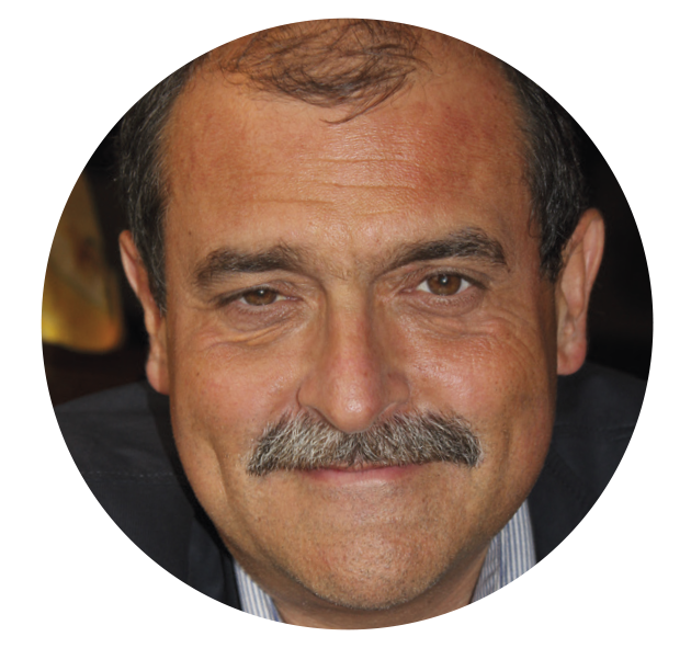 Portrait von Herr Hörmann. Mann mit dunklem Haar und Bart.